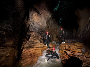 Tubing the black underground river on the Black Abyss tour.