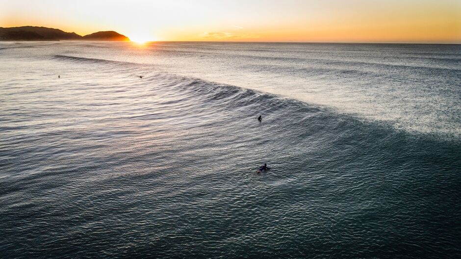 Surfing at sunset