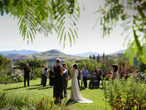 Choose to say 'I do' amidst our stunning gardens and share a moment that you will remember for a lifetime, surrounded by majestic oaks and tranquil water features, with the unmistakable backdrop of the lake and mountains silhouetted against the sky.