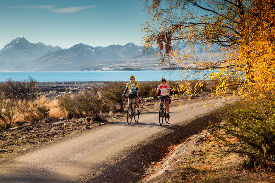 The distinctive turquoise blue colors of Lake Pukaki with Mt. Cook in the distance reward us on the Alps to Ocean Trail.