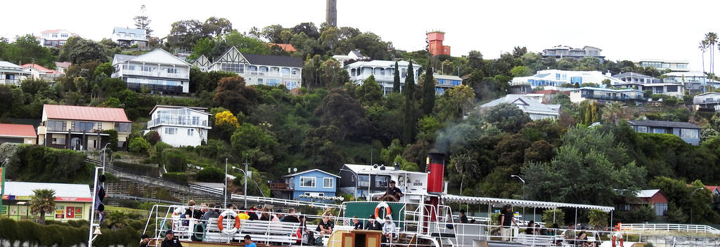 The Paddle Steamer Waimarie leaving her berth with the Durie Hill Memorial Tower and Elevator Tower in the background