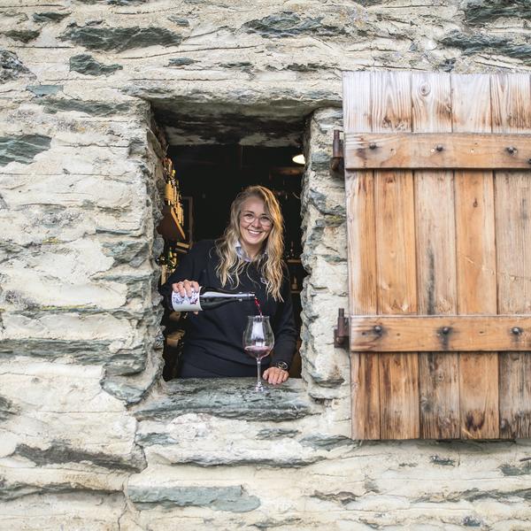 Pouring a glass of red wine at Millbrook Resort in Arrowtown