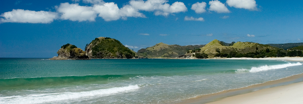 Great Barrier Island is a world away from Auckland City. It's white sand beaches promise to beckon you for a swim.