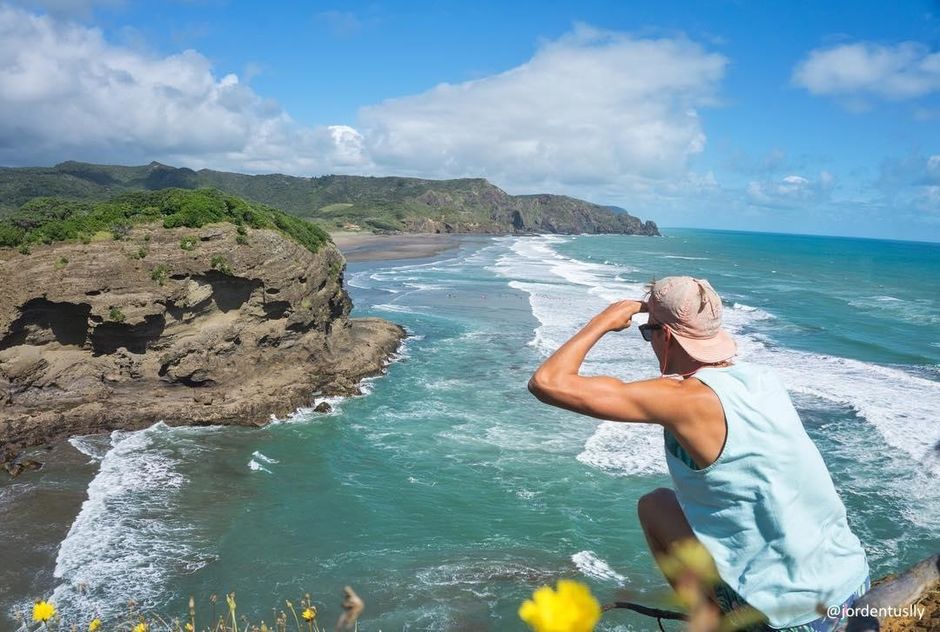 Taking in the break at Bethells, one of Auckland's many west coast beaches that attract surfers from near and far.