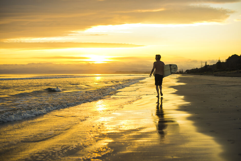 Surfing Ōhope Beach sunrise