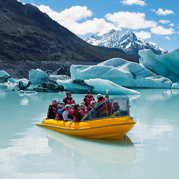 Glacier Explorers take visitors to see the Tasman Glacier and touch floating ice