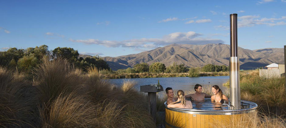 Soak in a hot pool amidst beautiful landscapes in Ōmarama.