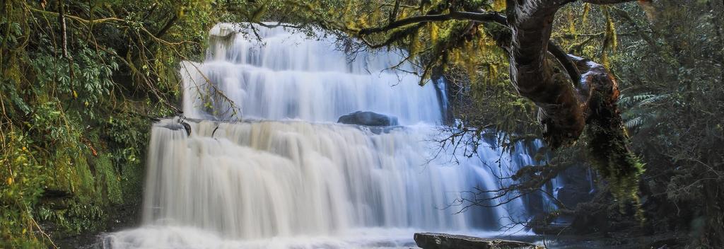 Marvel at the three-tiered waterfall in Clutha