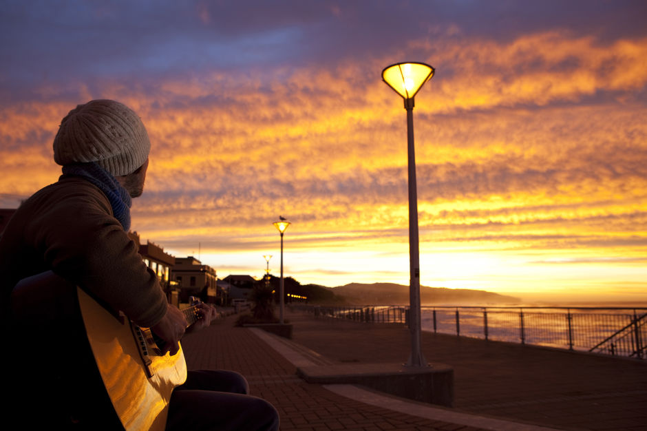 Find a spot on the waterfront at Saint Clair Beach in Dunedin and see if the New Year brings good surf on the first day.