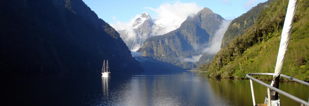 An overnight boat cruise lets you travel deeper into Milford or Doubtful Sound.