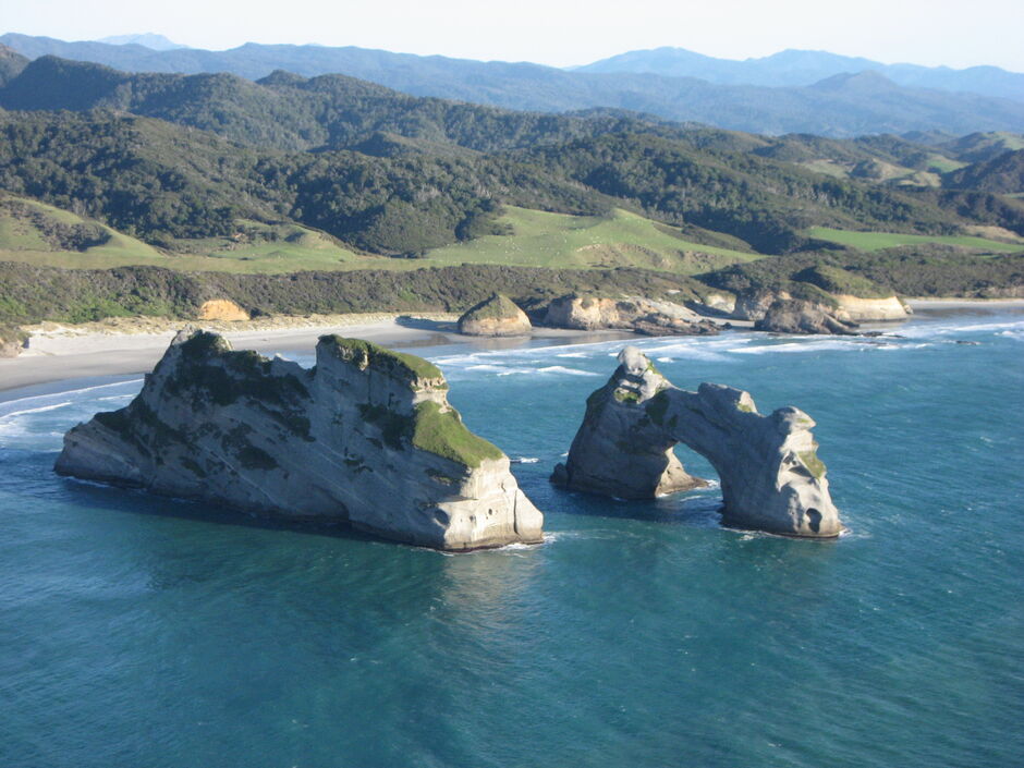 Wharariki sea arches on the Golden Bay Air West Coast scenic flight