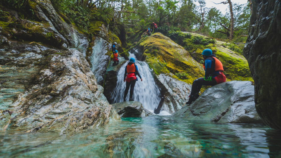 Abseiling down waterfall