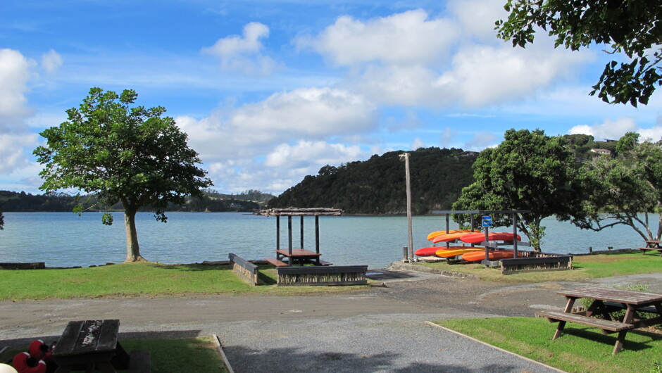 Powered camper van site with water view