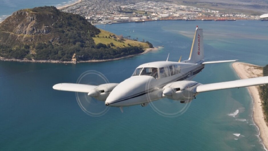 A Sunair scenic flight soars over Mauao (Mt Maunganui),Mount Main Beach and Tauranga Harbour