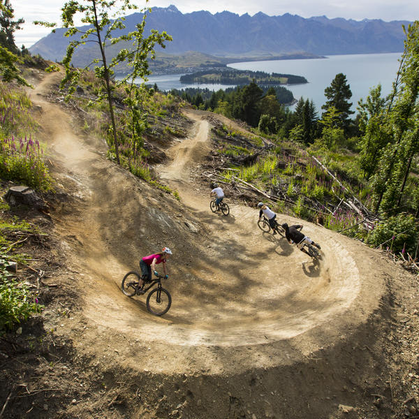 Enjoy stunning lake views as you bolt down the Queenstown Bike Park tracks.