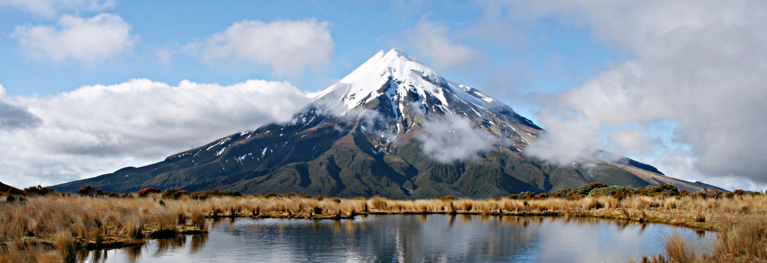 Get perfect views of Mount Taranaki during rewarding hike of the Pouakai Circuit in the northern region of Egmont National Park.