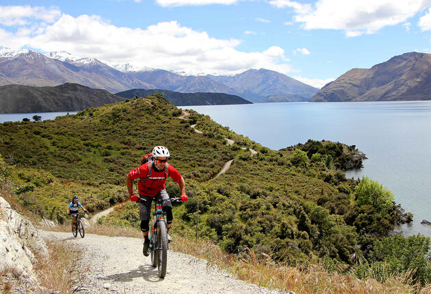 Epic views of Lake Wānaka and the surrounding mountains are ever-present on these mainly easy mountain biking trails heading east and west from central Wānaka.