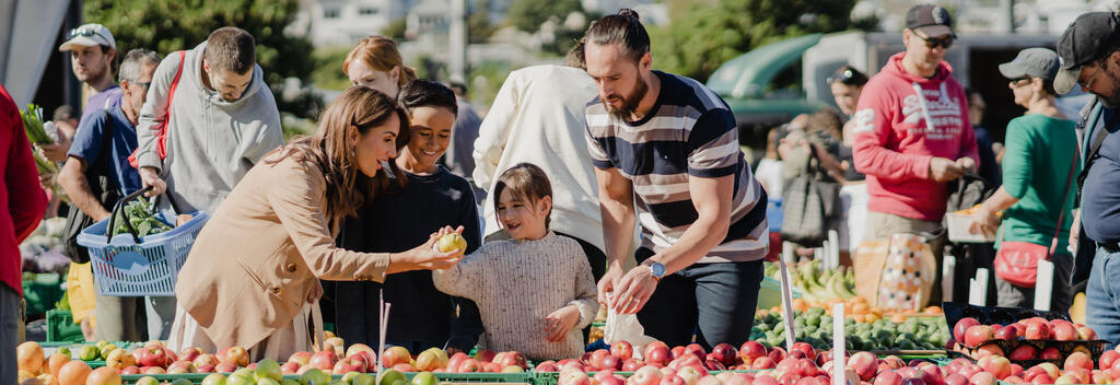 Family browsing produce at Harbourside Market, Wellington