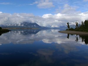 A mirror calm day on Lake Brunner, near Greymouth. Taken from the Arnold River Swing Bridge.