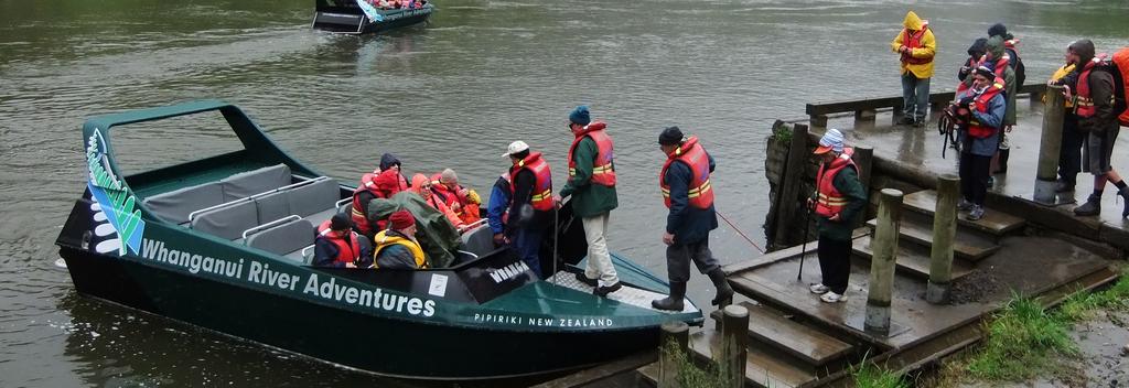 Jet boat loading at Pipiriki with Whanganui River Adventures