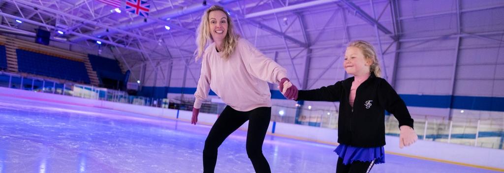 Mother and daughter ice skating at Dunedin Ice Stadium