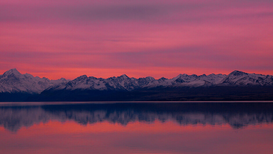 Lake Pukaki at dusk with Aoraki Mt Cook reflected in the calm evening waters.