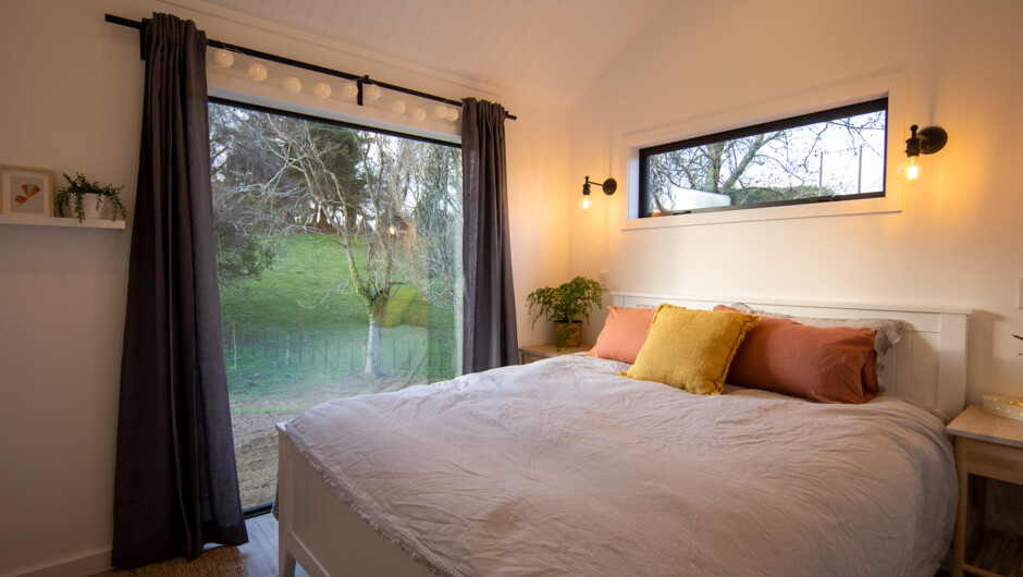 The gorgeous bedroom with a comfortable King-sized bed. and wardrobe