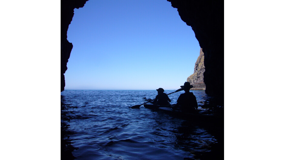 Sea-kayaking through a sea-cave of Pōhatu Marine Reserve