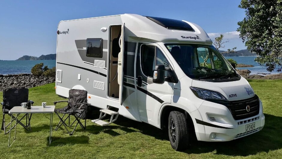 Compact luxury motorhome, fixed bed.