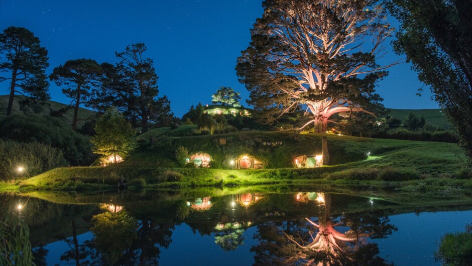 Glowing lights of the Shire against the darkness.