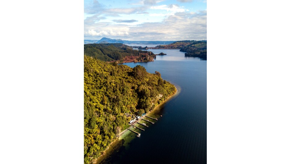 View looking down the lake towards Rotorua with the Lake Rotoiti Hot Pools tucked in on your left