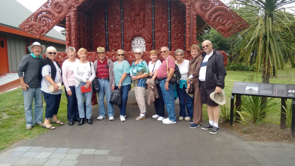 Cruise-ship group at Te Puia in front of pataka