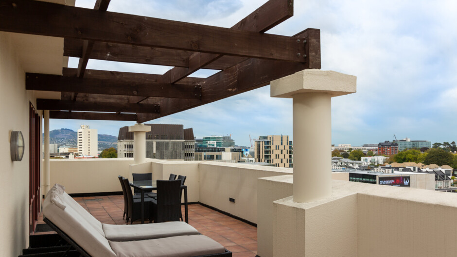 This apartment has a huge balcony with outdoor dining.