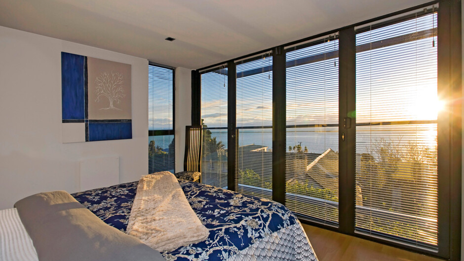 Golden glow of sunset in the master bedroom.