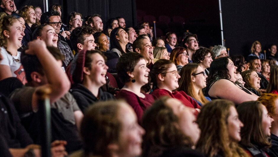 Audiences enjoying Scared Scriptless improvised comedy.