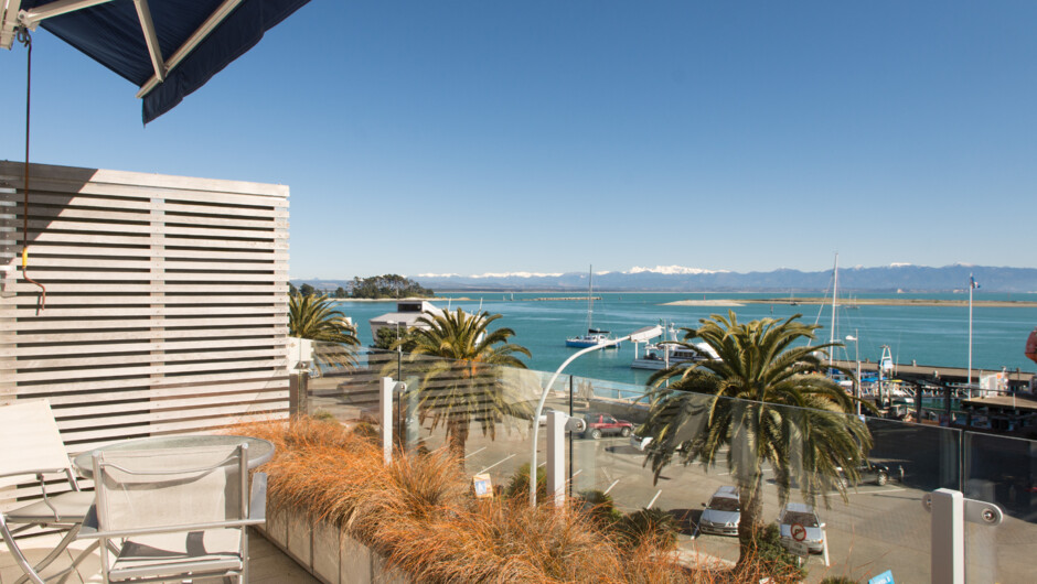 Balcony with views & outdoor setting.