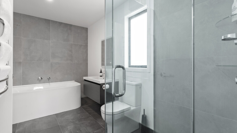 Master bedroom ensuite with bathtub.