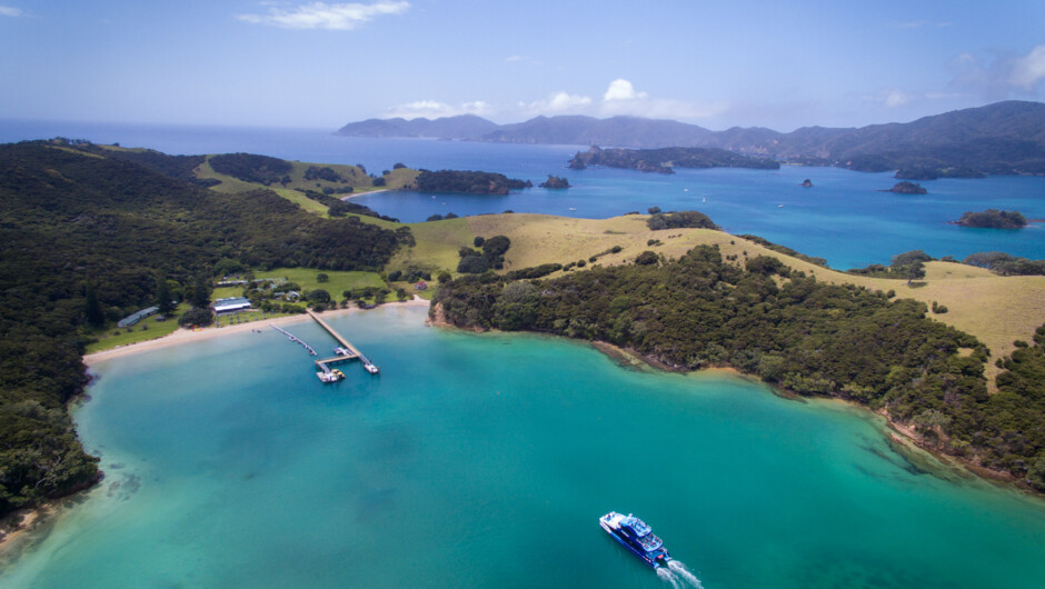 Fullers GreatSights vessel cruising into Otehei Bay