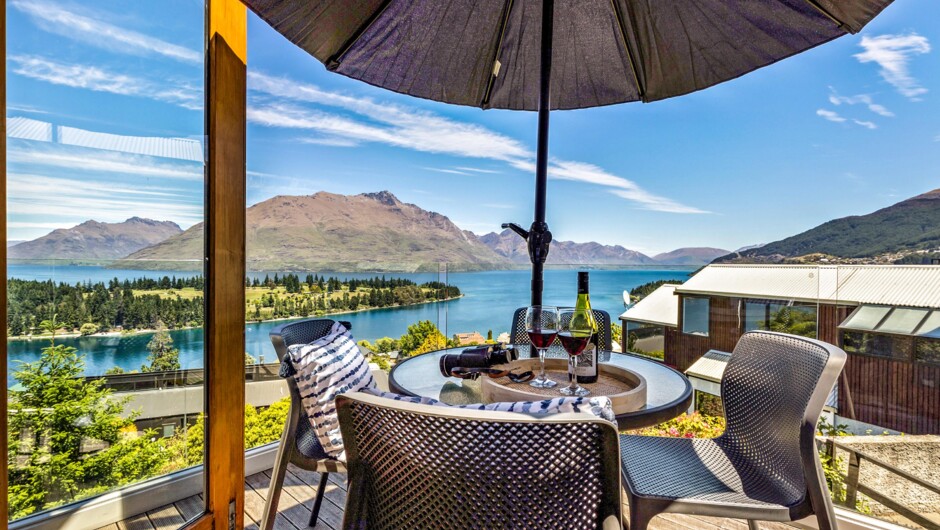 Private balcony with outdoor dining and stunning views of Lake Wakatipu