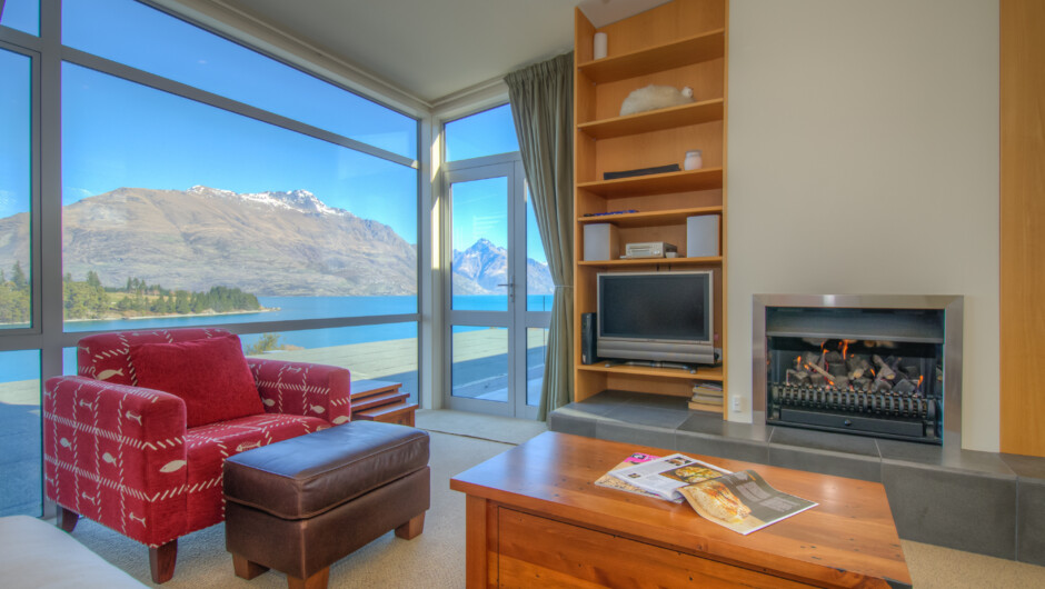 Living room with fireplace and balcony access