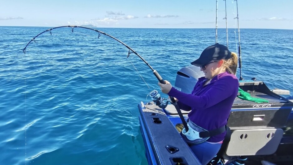 Families enjoying a day out fishing.