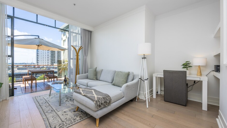 Spacious living area flows out to the large sunny balcony.