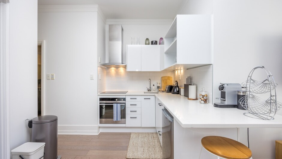 Stylish kitchen comes equipped with modern appliances.