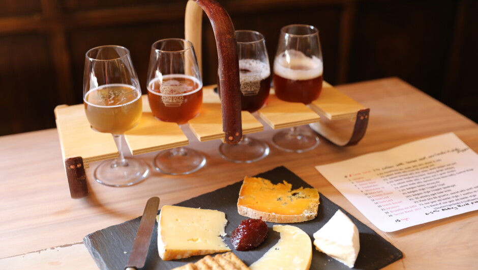 A tasting tray of our beer and a cheese slate