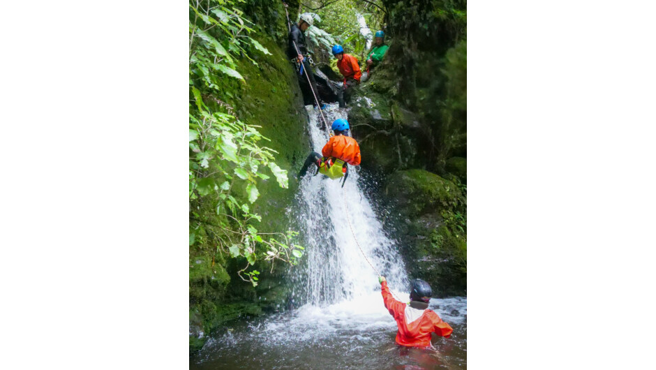 Self Abseiling down a waterfall