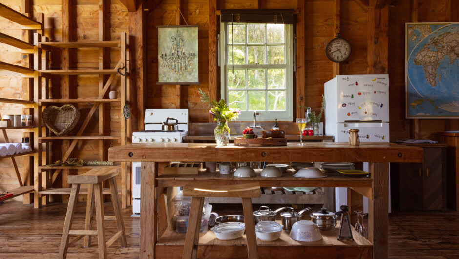 Well equipped kitchen with fridge and gas oven powered on solar power.