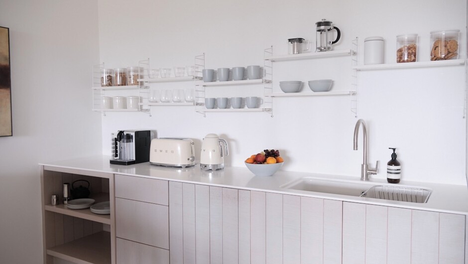 Kitchenette with fridge, microwave, kettle, toaster, Nespresso machine.  First day continental breakfast and snacks provided.