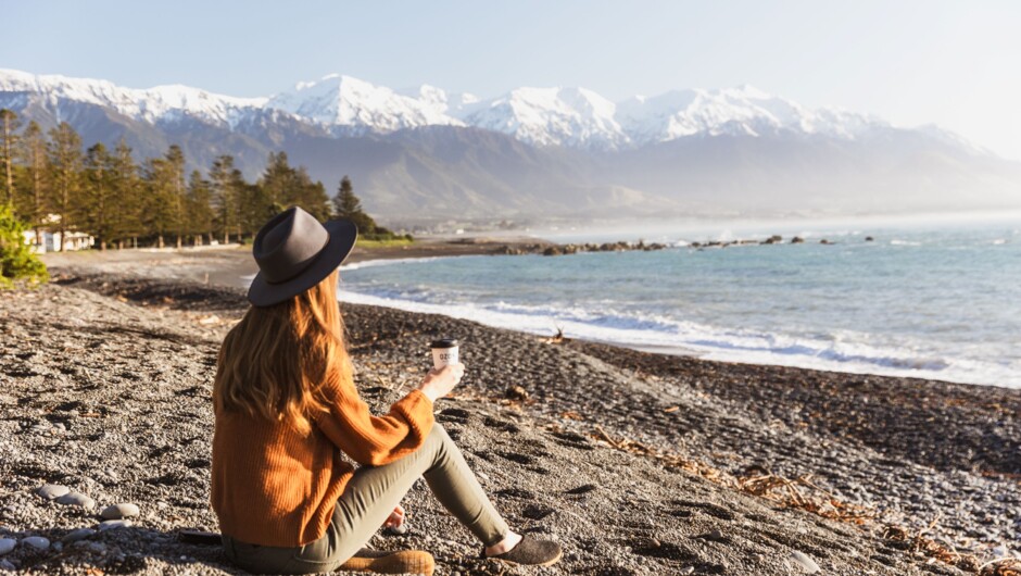 Opposite Kaikoura Luxury Apartments, enjoying the Pacific Ocean beach with views of the Kaikoura mountains.