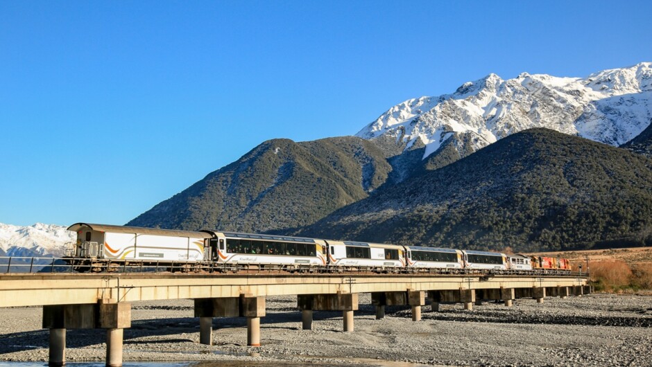 The TranzAlpine glides past Lake Sarah in a stunning autumn/winter scene