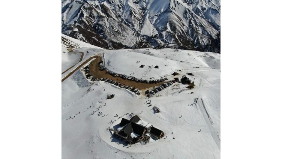 Drone shot of the carpark & Lodge with the mighty Mt Tinline in the background